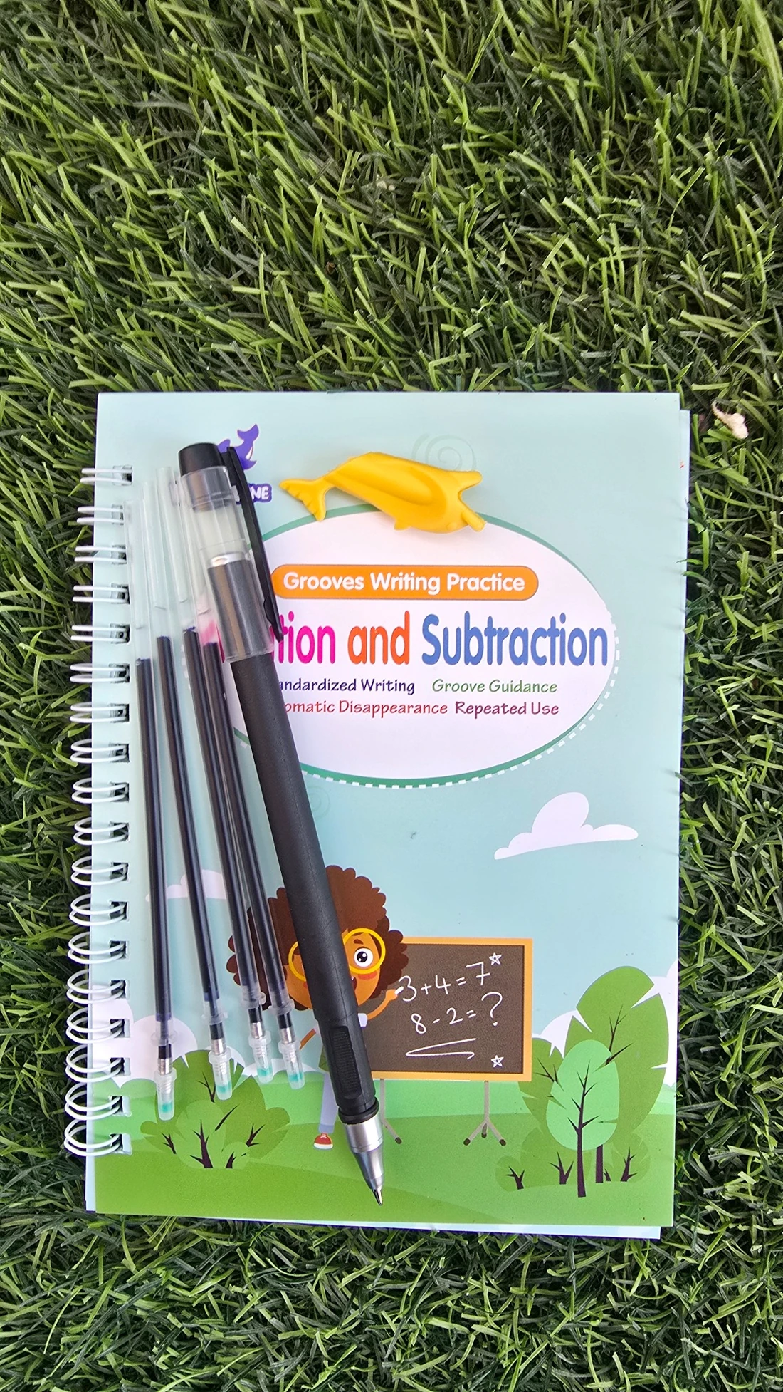 Writing practice workbook with its included pen and ink refills